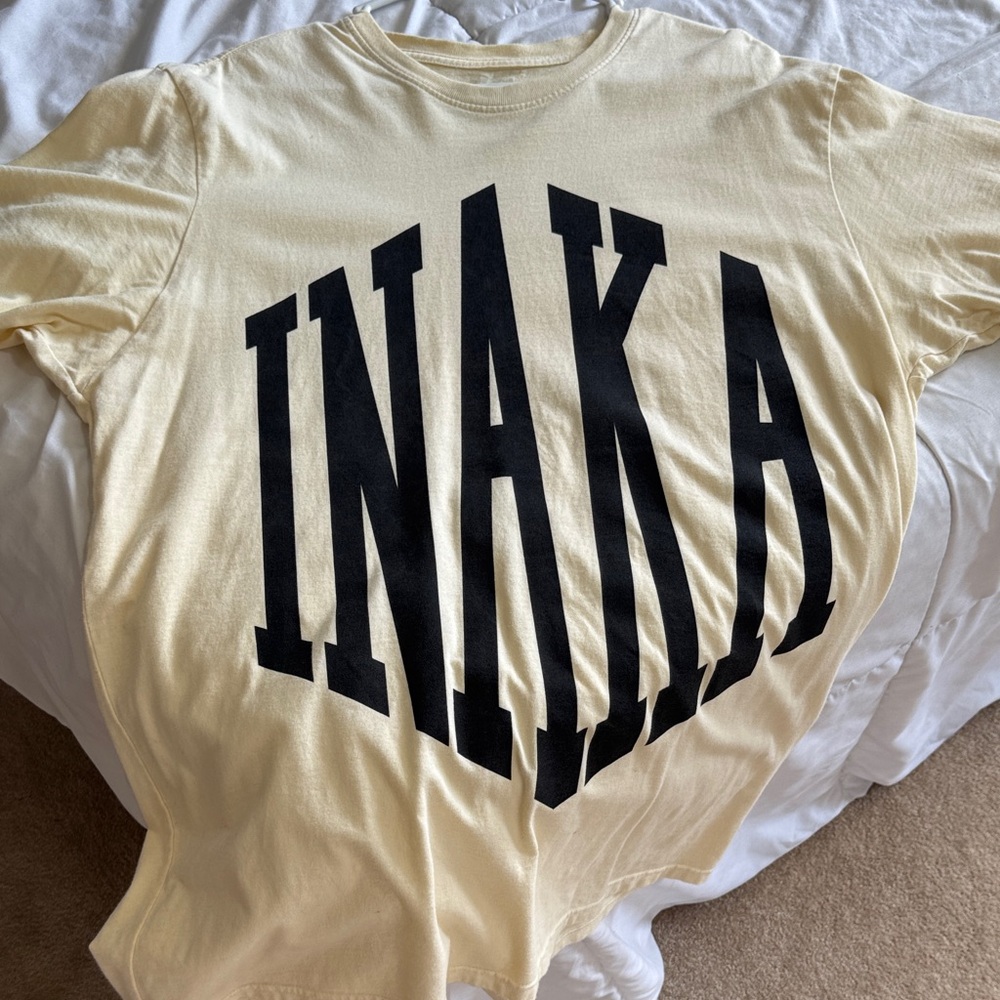 Inaka Power Cream Shirt with Purple Tag
